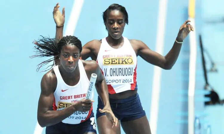 Victoria Ohuruogu hands baton to Christine Ohuruogu at Sopot 2014 (Credit: Mark Shearman)