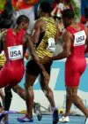 The US team drops the baton in the men's 4x200m final